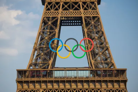 epa11439911 The Eiffel tower decorated with the Olympic rings seen from the working site of the opening ceremony at the Trocadero in Paris, France, 26 June 2024. The opening ceremony of the Paris 2024 Olympic Games will begin with a nautical parade on the Seine and ends on the protocol stage in front of the Eiffel Tower on 26 July 2024. EPA/CHRISTOPHE PETIT TESSON