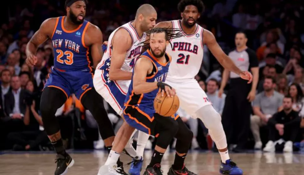 Apr 30, 2024; New York, New York, USA; New York Knicks guard Jalen Brunson (11) handles the ball against Philadelphia 76ers forward Nicolas Batum (40) and center Joel Embiid (21) during the first quarter of game 5 of the first round of the 2024 NBA playoffs at Madison Square Garden. Mandatory Credit: Brad Penner-USA TODAY Sports/Sipa USA Photo: USA Today Sports/SIPA USA