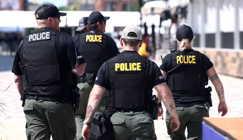 epa11478884 Corrections officers from North Dakota patrol the exterior of the Fiserv Forum, which will host the Republican National Convention (RNC), in the wake of the assassination attempt of former President Trump in Milwaukee, Wisconsin, USA, 14 July 2024. The Republican National Convention (RNC) takes place in Milwaukee from July 15 to 18, with Trump expected to address the convention on the last day. EPA/JIM LO SCALZO