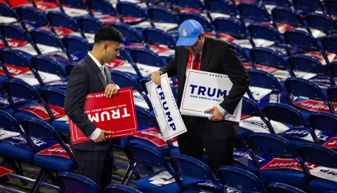 epa11480173 Volunteers place Trump signs on seats before the opening of the Republican National Convention (RNC) in the Fiserv Forum in Milwaukee, Wisconsin, USA, 15 July 2024. The convention comes just a two days after a 20-year-old man attempted to assassinate former president and current Republic presidential nominee Donald J. Trump. The 2024 Republican National Convention is being held 15 to 18 July 2024 in which delegates of the United States Republican Party select the party's nominees for president and vice president in the 2024 United States presidential election. EPA/JIM LO SCALZO