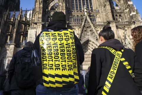 epaselect epa11108545 A protester with anti-AFD tape on his back in front of Cologne Cathedral, during a demonstration against the far-right Alternative for Germany (AfD) party in Cologne, Germany, 27 January 2024. According to the alliance 'Together against the right,' rallies are planned in more than 200 cities and municipalities across Germany from 26 to 28 January. EPA/Christopher Neundorf