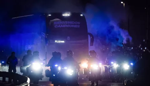 epa11480913 The bus of the Argentine soccer team arrives with part of the team after the victory in the final of the Copa America 2024 in Ezeiza, Argentina, 15 July 2024. After winning the sixteenth Copa America for Argentina in the United States, part of the Albiceleste team that defeated Colombia 1-0 in the final arrived in Buenos Aires, where thousands of people gathered around the airport waiting for their favorite team members. EPA/JUAN IGNACIO RONCORONI