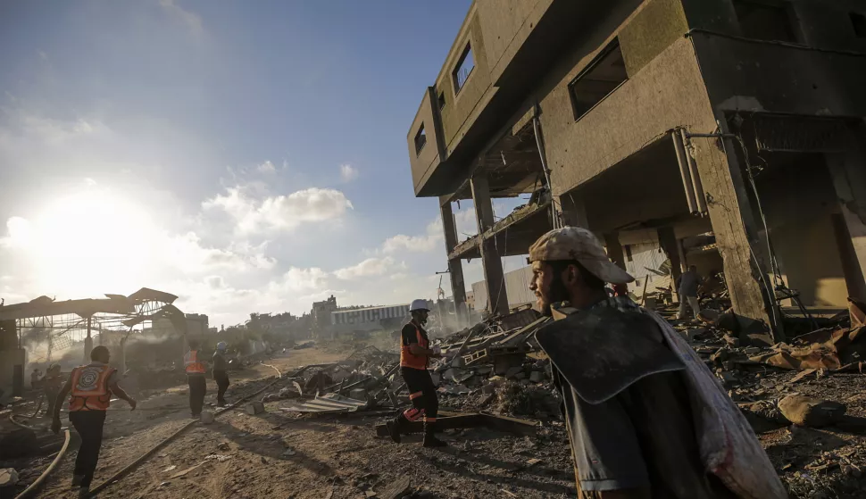 epa11488461 Palestinians inspect the rubble of a destroyed building following an Israeli air strike in the Al-Zawaida neighborhood, central Gaza Strip, 19 July 2024. More than 38,000 Palestinians and over 1,400 Israelis have been killed, according to the Palestinian Health Ministry and the Israel Defense Forces (IDF), since Hamas militants launched an attack against Israel from the Gaza Strip on 07 October 2023, and the Israeli operations in Gaza and the West Bank which followed it. EPA/MOHAMMED SABER