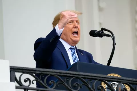 epa08734888 A bandage is seen on US President Donald J. Trump's hand while speaking from the Truman Balcony of the White House in Washington, DC, USA, on 10 October 2020. Trump, making his first public appearance since returning from a three-day hospitalization for Covid-19, is setting the stage for a return to the campaign trail even as questions remain about whether he's still contagious. EPA/ERIN SCOTT/POOL