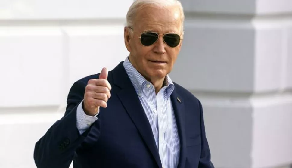 epa11229411 US President Joe Biden gestures as he departs the White House Washington, DC, USA, 19 March 2024. The president is due to attend campaign events in Reno, Nevada. EPA/WILL OLIVER