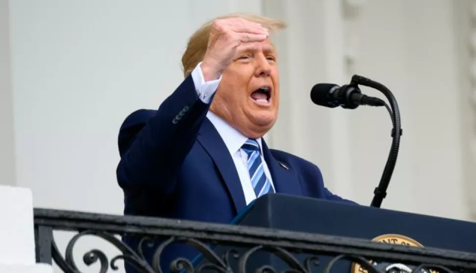 epa08734888 A bandage is seen on US President Donald J. Trump's hand while speaking from the Truman Balcony of the White House in Washington, DC, USA, on 10 October 2020. Trump, making his first public appearance since returning from a three-day hospitalization for Covid-19, is setting the stage for a return to the campaign trail even as questions remain about whether he's still contagious. EPA/ERIN SCOTT/POOL