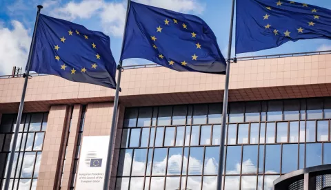 epa11480936 European Union flags flutter near the logo of the Hungarian Presidency of the European Council before the start of the Economic and Financial Affairs Council meeting in the European Council in Brussels, Belgium, 16 July 2024. EPA/OLIVIER MATTHYS