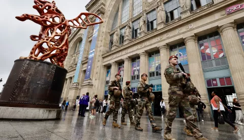 epa11496932 French military personnel patrol outside Gare du Nord station in Paris, France, 26 July 2024. France's high speed rail network TGV was severely disrupted on 26 July following a 'massive attack', according to train operator SNCF, just hours before the opening ceremony of the Paris 2024 Olympic games. French Transport Minister Patrice Vergriete condemned 'these criminal actions' saying that they would 'seriously disrupt traffic' until this weekend. Around 800,000 passengers are expected to be affected over the weekend. EPA/RITCHIE B. TONGO