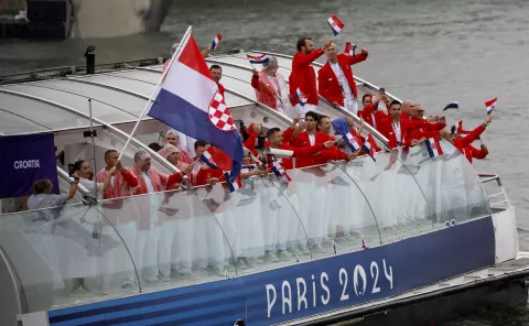 epa11497998 Members of the delegation of Croatia wave from their boat during the Opening Ceremony of the Paris 2024 Olympic Games, in Paris, France, 26 July 2024. EPA/Miguel Tona/POOL