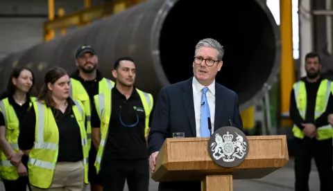 epa11495735 British Prime Minister Keir Starmer (C-R) delivers a speech during a visit to Hutchinson Engineering, in Widnes, Britain, 25 July 2024. 'I don't just want to be in the race for clean energy; I want us to win the race for clean energy,' Starmer said. EPA/ANTHONY DEVLIN/POOL