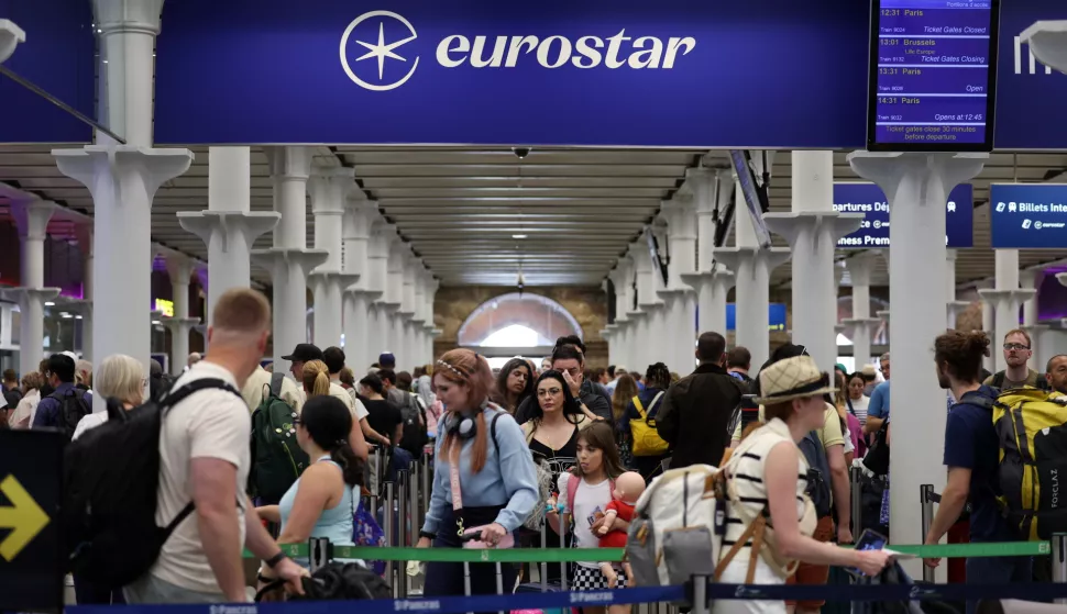 epa11497102 Rail passengers queue up at Eurostar rail terminal at St. Pancras International station in London, Britain, 26 July 2024. Eurostar has cancelled some trains from London to Paris due to arson attacks on the French rail network. Cancellations may continue into the weekend. France's high speed rail network TGV was severely disrupted on 26 July following a 'massive attack', according to French train operator SNCF, just hours before the opening ceremony of the Paris 2024 Olympic games. EPA/ANDY RAIN