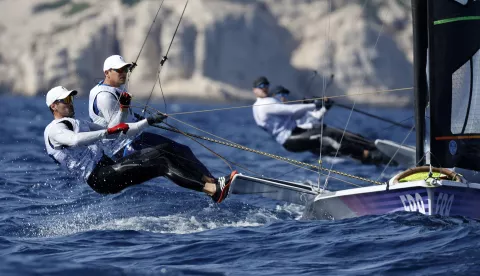 epa11503675 Erwan Fischer and Clement Pequin of France in action on their 49er FX skiff during the Men's Skiff opening series race of the Sailing competitions in the Paris 2024 Olympic Games, in Marseille, France, 28 July 2024. EPA/SEBASTIEN NOGIER