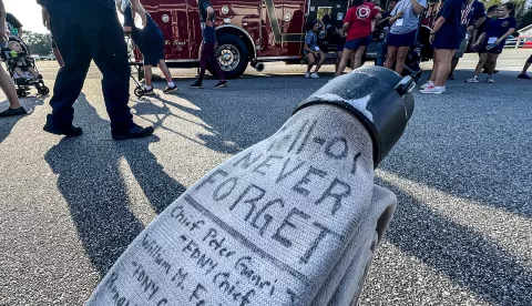 Sept 10, 2023; Belton, SC, USA; A firehose with the words "9-11-01, Never Forget" and names of fallen from the events of Sept 11. Firemen, family and supporters walk in the 9/11 Walk to Remember, starting from Rock Springs fire station 2.5 miles to Belton, with ceremonial bell ringing at the Belton fire station Sunday, September 10, 2023. The event welcomes all first responders, families and citizens to come and show support for the lives lost on September 11, 2001. Mandatory Credit: Ken Ruinard-USA TODAY NETWORK/Sipa USA Photo: USA TODAY NETWORK/SIPA USA