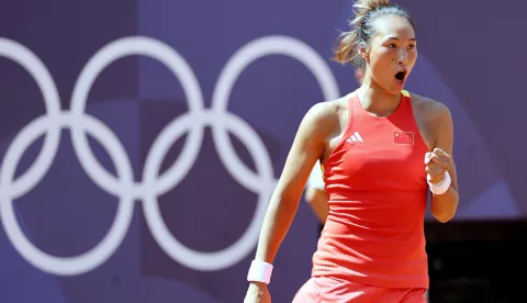 epa11515156 Qinwen Zheng of China in action during her Women's Singles semi final match against Iga Swiatek of Poland of the Tennis competitions in the Paris 2024 Olympic Games, at the Roland Garros in Paris, France, 01 August 2024. EPA/RONALD WITTEK