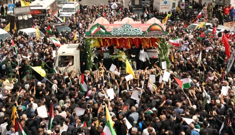 epa11514215 People gather as the coffins of Hamas late political leader Ismail Haniyeh and his bodyguard are carried on the back of a truck during a funeral procession in Tehran, Iran, 01 August 2024. Haniyeh and one of his bodyguards were targeted and killed in Tehran on 31 July 2024, the Iranian Revolutionary Guard Corps (IRGC) confirmed. EPA/ABEDIN TAHERKENAREH