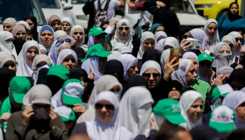 Palestinians wave flags and chant slogans in the occupied West Bank city of Hebron on July 31, 2024, during a demonstration denouncing the killing of the leader of Hamas. Hamas said its political leader Ismail Haniyeh was killed in an Israeli strike in Iran early on July 31, where he was attending the swearing-in of the new president, and vowed the act "will not go unanswered". Photo by Wahaj Bani Moufleh/Middle East Images/ABACAPRESS.COM Photo: Middle East Images/ABACA/ABACA