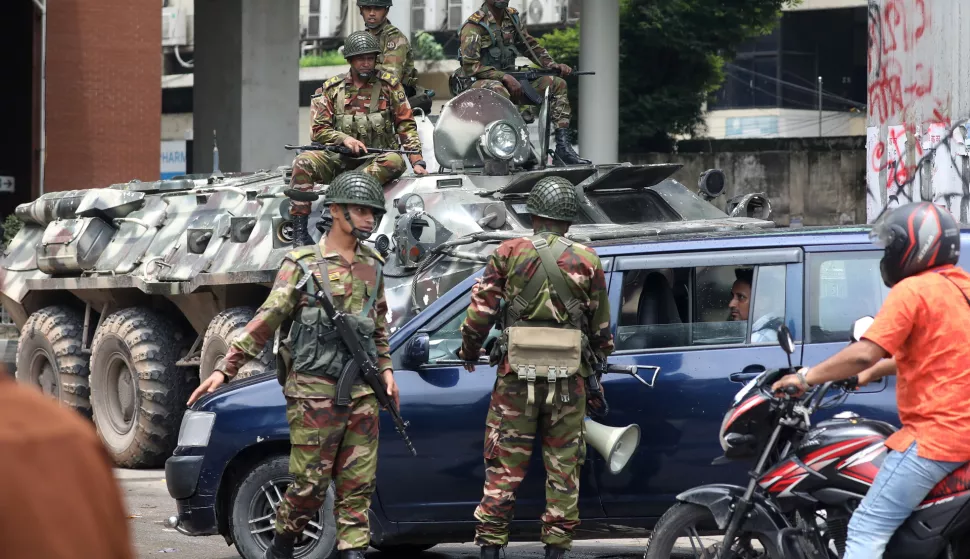 epa11526689 Bangladeshi Army soldiers patrol on the street after the government imposed a new curfew, in Dhaka, Bangladesh, 05 August 2024. Dhaka authorities have imposed a new curfew starting 06:00 p.m. local time on 04 August. As casualties mounted and law enforcement struggled to contain the unrest, the Bangladeshi government on 20 July 2024 had imposed an initial nationwide curfew and deployed military forces after violence broke out in Dhaka and other regions following student-led protests demanding reforms to the government's job quota system. EPA/MONIRUL ALAM