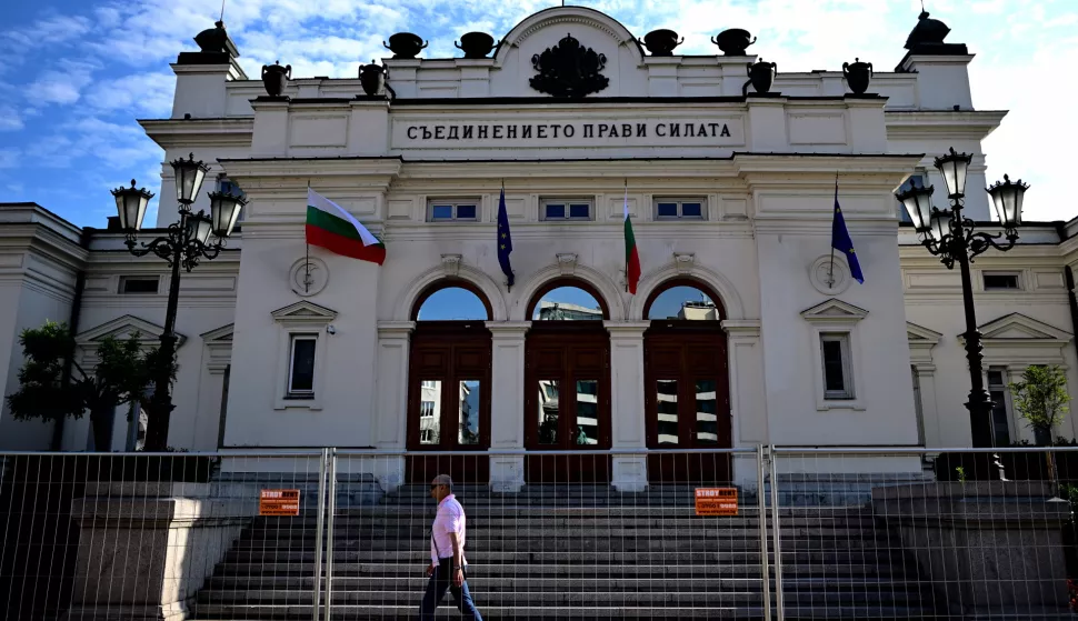 epa10096784 A man passes in front of Bulgarian Parliament in Sofia on 29 July 2022. Bulgaria, which last year celebrated three general elections to achieve the difficult formation of the Government at the end of December, will have to organize the fourth in 18 months after the failure of the third and last attempt to create the Executive. Once the options are exhausted, the president will have to dissolve the Parliament on 01 or 02 August, convene elections within 60 days, which will end on an electoral date for 02 October, and to designate an interim Government until the creation of regular Government after the elections. EPA/VASSIL DONEV