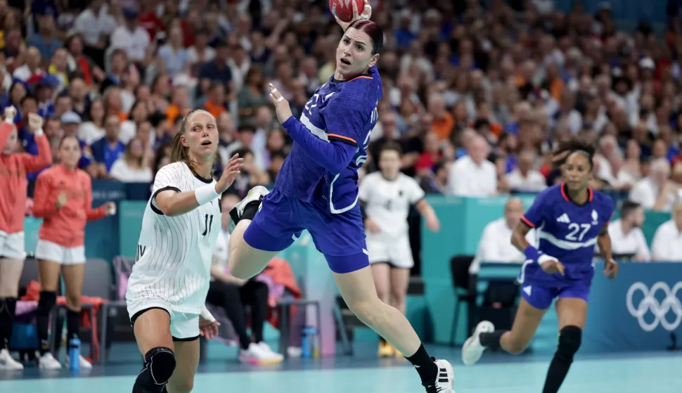 epa11530300 Tamara Horacek (front) of France in action against Xenia Smits (L) of Germany during the Handball competitions in the Paris 2024 Olympic Games, at the Pierre Mauroy Stadium in Villeneuve-d'Ascq, France, 06 August, 2024. EPA/ALEX PLAVEVSKI