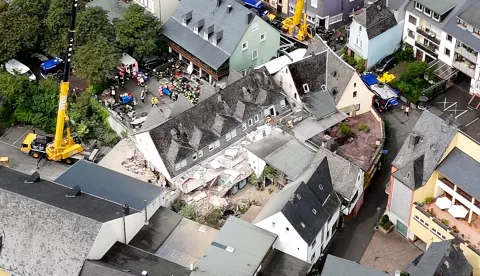 epa11532998 A video grab taken from an aerial video shows rescuers working at the scene of a hotel that partly collapsed in Kroev, Germany, 07 August 2024. At least two were killed and several others injured, local authorities said. 14 people were in the hotel when one floor of the building collapsed, according to police. EPA/NonstopNews