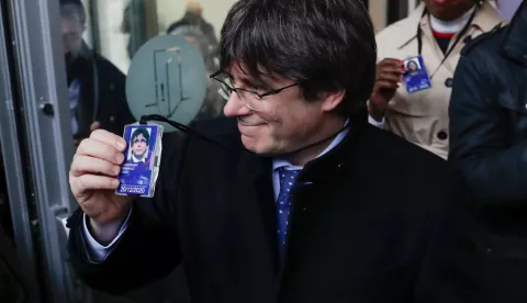 epa08083136 Former Catalan leader Carles Puigdemont (L) departs from the accreditation center of the European Parliament after the decision of the European Court of Justice in Brussels, Belgium, 20 December 2019. The European Court of Justice has ruled on 19 December that Catalan separatist leader Oriol Junqueras has an MEP immunity when he was jailed by the Spanish Supreme Court in October, prompting calls for his immediate release. EPA/STEPHANIE LECOCQ