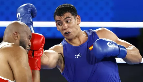 epa11535108 Djamili-Dini Aboudou Moindze of France (red) and Ayoub Ghadfa Drissi El Aissaoui of Spain in action during their Men's +92kg semi final of the Boxing competitions in the Paris 2024 Olympic Games, at Roland Garros in Paris, France, 07 August 2024. EPA/YOAN VALAT