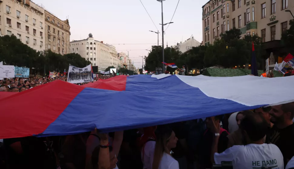 epa11543626 Protestors wave a giant flag of Serbia during a rally against plans to start mining lithium in Serbia, in Belgrade, Serbia, 10 August 2024. Plans to open lithium mines in Serbia were halted in 2021 after environmental groups started protesting against the proposed projects in different parts of Serbia but several wildlife preservation organizations and NGOs are warning that Rio Tinto and other mining companies have restarted their intentions for operations in the country. EPA/ANDREJ CUKIC