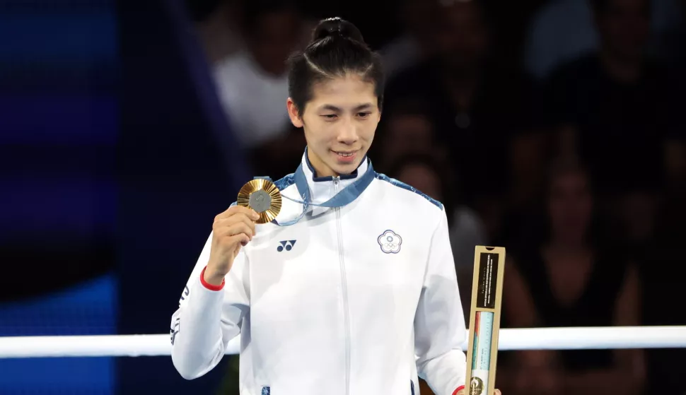 epa11544084 Gold medal winner Lin Yu Ting of Taiwan poses on the podium of the Women's 57kg category of the Boxing competitions in the Paris 2024 Olympic Games, at Roland Garros in Paris, France, 10 August 2024. EPA/YAHYA ARHAB