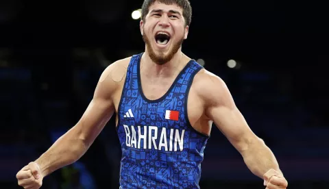 epa11544998 Akhmed Tazhudinov of Bahrain (blue) reacts after he wins the Men's Freestyle 97kg Final Match against Givi Matcharashvili of Georgia at the Wrestling competitions in the Paris 2024 Olympic Games, at the Champs-de-Mars Arena in Paris, France, 11 August 2024. EPA/FRANCK ROBICHON