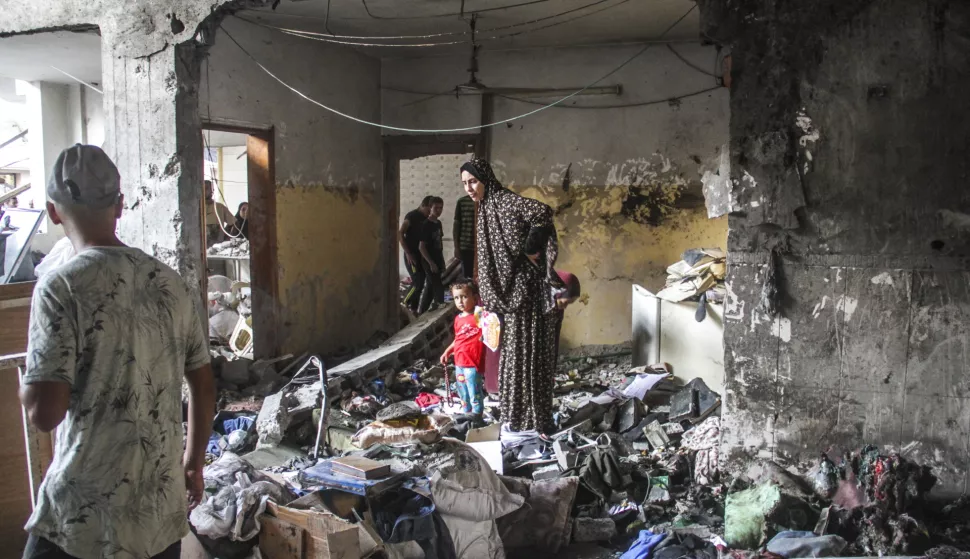 epa11541962 Palestinians inspect the damage following an Israeli strike on the Al-Taba'een school in the Daraj Tuffah neighborhood of Gaza, 10 August 2024. At least 93 people were killed in the strike, said the director of Al-Ahli Hospital in Gaza City. According to the Israel Defense Forces (IDF) the strike was carried out against a Hamas 'control center embedded in the Al-Taba'een school, adjacent to a mosque in Daraj Tuffah, which serves as a shelter for the residents of Gaza City'. More than 39,600 Palestinians and over 1,400 Israelis have been killed, according to the Palestinian Health Ministry and the Israel Defense Forces (IDF), since Hamas militants launched an attack against Israel from the Gaza Strip on 07 October 2023, and the Israeli operations in Gaza and the West Bank which followed it. EPA/MAHMOUD ZAKI