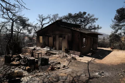 epa11547399 A burnt house after a wildfire in the area of Vrilissia close to Athens city, Greece, 13 August 2024. A wildfire that broke out on 11 August in the outskirts of Athens and spread to a large part of northeastern Attica no longer had a single front on 13 August. The fire stretched along a front more than 30 kilometres in length. According to the Fire Brigade, the firefighting forces are dealing with scattered pockets of fire from Varnavas to Nea Makri and Penteli while there are constant rekindlings. Firefighters found a charred body, of a 60-year-old woman, in a small factory that caught fire in Patima Halandriou. EPA/GEORGE VITSARAS