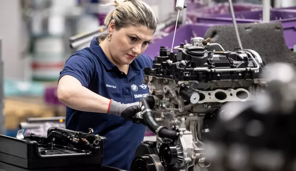 epa10578826 A worker assembles an engine at the engine assembly at the Bayerische Motoren Werke AG (BMW) AG Group factory in Steyr, Austria, 18 April 2023. BMW plans to produce more than 600,000 electric motors by 2025 and invests one billion euro by 2030 in a new plant for electric motors at the factory in Steyr. EPA/CHRISTIAN BRUNA