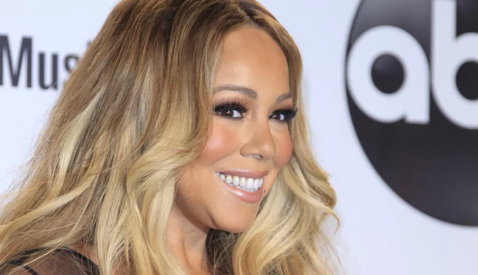 epa07082137 US singer Mariah Carey poses in the press room during the 2018 American Music Awards at the Microsoft Theater in Los Angeles, California, USA, 09 October 2018. EPA/NINA PROMMER