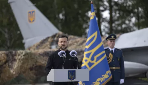 epa11525678 A handout picture made available by the Presidential Press Service shows Ukrainian President Volodymyr Zelensky speaking to servicemen next to an American single-engine supersonic multirole fighter F-16 jet during a ceremony to mark Air Force Day of the Armed Forces of Ukraine at an undisclosed location in Ukraine, 04 August 2024, amid the Russian invasion. Zelensky emphasized that the number of F-16 aircraft and trained pilots is still insufficient, as the country waits for additional fighters from partner countries. EPA/PRESIDENTIAL PRESS SERVICE HANDOUT HANDOUT EDITORIAL USE ONLY/NO SALES