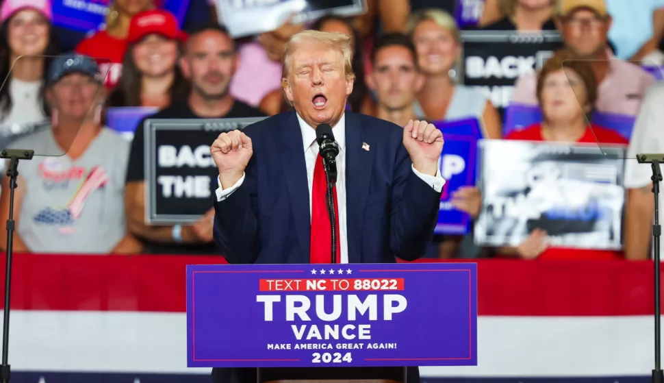 epa11495038 Republican presidential candidate Donald J. Trump gestures during a campaign rally at Bojangles Coliseum in Charlotte, North Carolina, USA, 24 July 2024. EPA/DAVID JENSEN