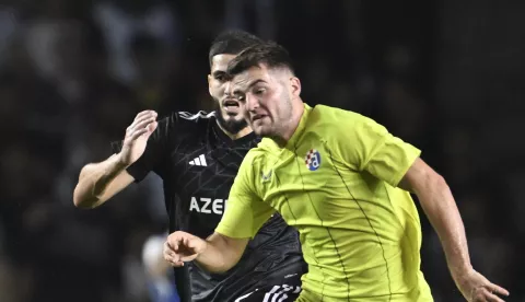 epa11569482 Yassine Benzia (L) of Qarabag in action against Martin Baturina of Dinamo during the UEFA Champions League, play-offs 2nd leg match between Qarabag and Dinamo at the Tofiq Bahramov Republican stadium in Baku, Azerbaijan, 28 August 2024. EPA/ROMAN ISMAILOV