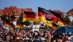 epa11575677 Supporters of far-right Alternative for Germany (AfD) party await the speech of faction chairman in the regional parliament of Thuringia Bjoern Hoecke, top candidate for the upcoming 2024 Thuringia state election during the final election campaign rally in Erfurt, Germany, 31 August 2024. Thuringia state election, voting for the regional parliament 'Landtag', will be held on 01 September 2024. EPA/CLEMENS BILAN