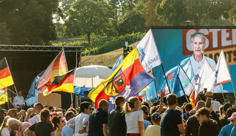 epa11575550 Bjoern Hoecke (R, on large screen), far-right Alternative for Germany (AfD) party faction chairman in the regional parliament of Thuringia and top candidate for the upcoming 2024 Thuringia state election speaks during the final election campaign rally in Erfurt, Germany, 31 August 2024. Thuringia state election, voting for the regional parliament 'Landtag', will be held on 01 September 2024. EPA/CLEMENS BILAN