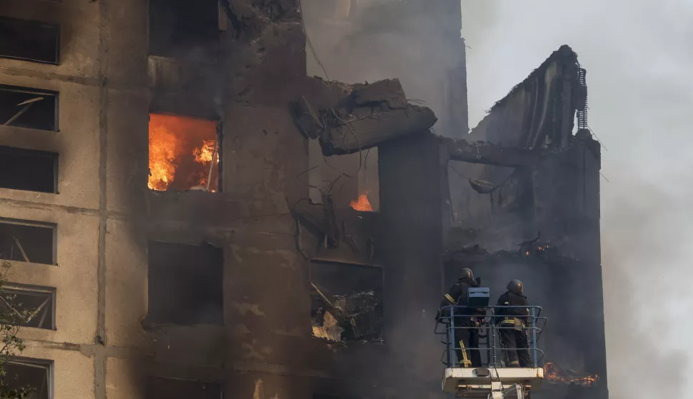 epaselect epa11573999 Ukrainian rescuers work at the site of a damaged 12-story residential building following a missile strike in Kharkiv, northeastern Ukraine, 30 August 2024, amid the Russian invasion. At least six people have been killed, including a 14-year-old girl, and 59 others injured, including nine children aged 5 to 16, after Russian missile strikes hit five locations in Kharkiv, the head of the Kharkiv Military Administration Oleg Synegubov wrote on telegram. Russian troops entered Ukrainian territory on 24 February 2022, starting a conflict that has provoked destruction and a humanitarian crisis. EPA/SERGEY KOZLOV