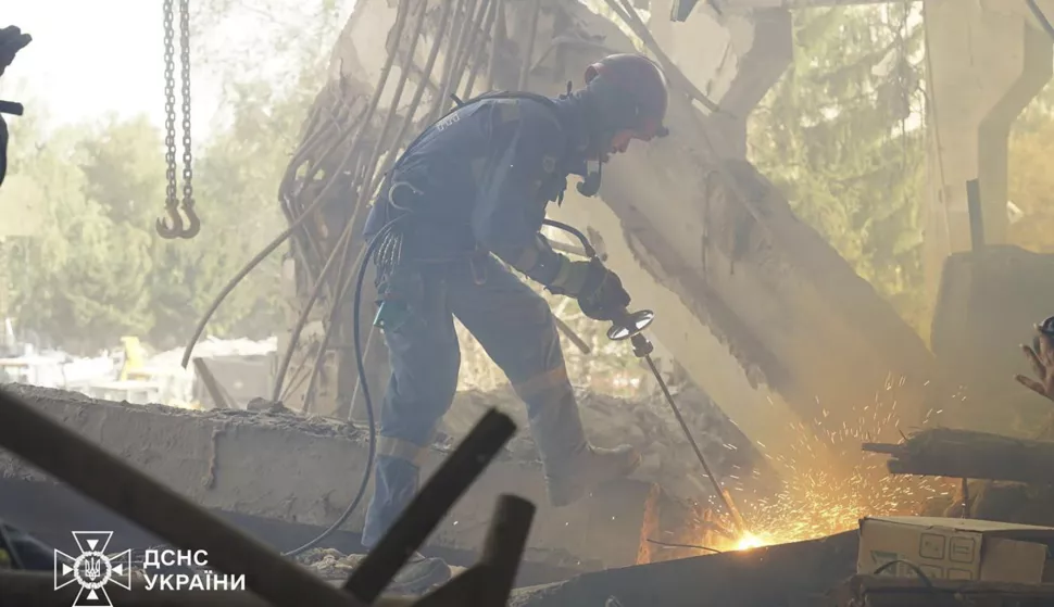 epa11586363 A handout photo released by the press service of the State Emergency Service (SES) of Ukraine shows Ukrainian rescuers working at the site of a rocket strike in Poltava, central Ukraine, 05 September 2024, amid the Russian invasion. As a result of a Russian rocket attack on 03 September 2024, the six-story building of the educational building was partially destroyed, three apartment buildings, five private houses and an office building were damaged. The death toll from a Russian strike on an educational institution in Poltava rose to at least 54 dead and 297 injured, SES said. Ukrainian rescuers continued to work at the site of the attack, where five more people are feared to be trapped under the rubble. Russian troops entered Ukrainian territory on 24 February 2022, starting a conflict that has provoked destruction and a humanitarian crisis. EPA/STATE EMERGENCY SERVICE OF UKRAINE HANDOUT -- BEST QUALITY AVAILABLE -- MANDATORY CREDIT: STATE EMERGENCY SERVICE OF UKRAINE -- HANDOUT EDITORIAL USE ONLY/NO SALES