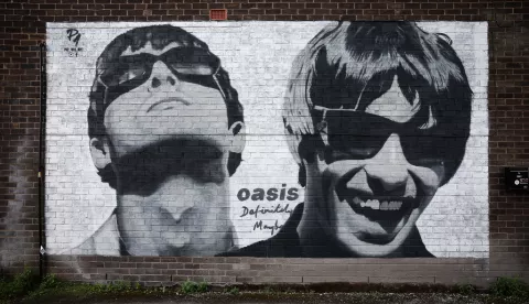 epa11570725 A mural of Liam and Noel Gallagher of British band Oasis is seen near Sifters Records in Manchester, Britain, 29 August 2024. The mural was painted by street artist Pic.One.Art in June 2024 to mark the 30th anniversary of the band's debut album, Definitely Maybe. Oasis have announced a number of live reunion concert dates in Cardiff, Manchester, London, Edinburgh, and Dublin, having reformed after a 15-year split. EPA/ADAM VAUGHAN