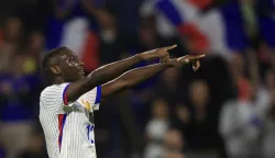 epa11595037 Randal Kolo Muani of France reacts after scoring the 1-0 lead during the UEFA Nations League group B soccer match between France and Belgium in Lyon, France, 09 September 2024. EPA/GUILLAUME HORCAJUELO