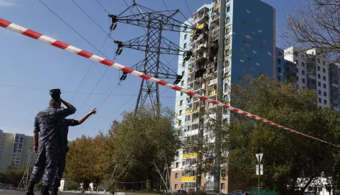 epa11595929 Russian policemen stand guard near a damaged apartment building following an alleged Ukrainian drone attack in Ramenskoye, Moscow region, Russia, 10 September 2024. A 46-year-old woman died in an overnight drone attack on Ramenskoye outside Moscow, the Moscow region's Governor Andrey Vorobyov said. EPA/YURI KOCHETKOV