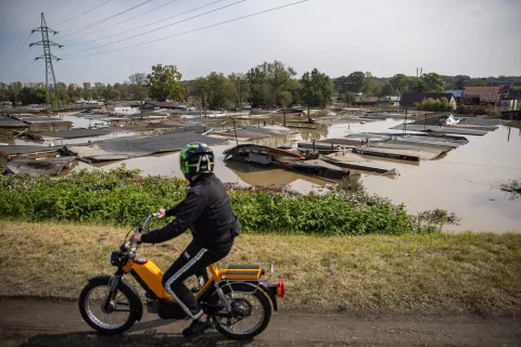 epa11609614 A man on motorbike passes a flood-affected area following heavy rain in town of Ostrava, Czech Republic, 17 September 2024. Floods caused by heavy rains brought by Storm Boris have caused at least 18 dead across central and eastern Europe since 13 September, with three dead and seven missing in the Czech Republic. EPA/MARTIN DIVISEK