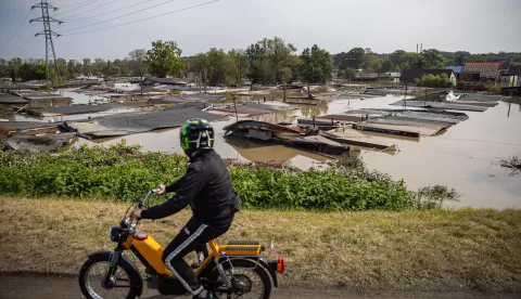 epa11609614 A man on motorbike passes a flood-affected area following heavy rain in town of Ostrava, Czech Republic, 17 September 2024. Floods caused by heavy rains brought by Storm Boris have caused at least 18 dead across central and eastern Europe since 13 September, with three dead and seven missing in the Czech Republic. EPA/MARTIN DIVISEK