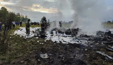 epa10816489 A handout picture made available by Russian Investigative Committee shows Russian emergency service work on the site of the plane crash near the village of Kuzhenkino, Tver region, Russia, 23 August 2023. An investigation was launched into the crash of an aircraft in the Tver region in Russia on 23 August 2023, the Russian Federal Air Transport Agency said in a statement. Among the passengers was Yevgeny Prigozhin, the agency reported. EPA/RUSSIAN INVESTIGATIVE COMMITEE HANDOUT HANDOUT EDITORIAL USE ONLY/NO SALES