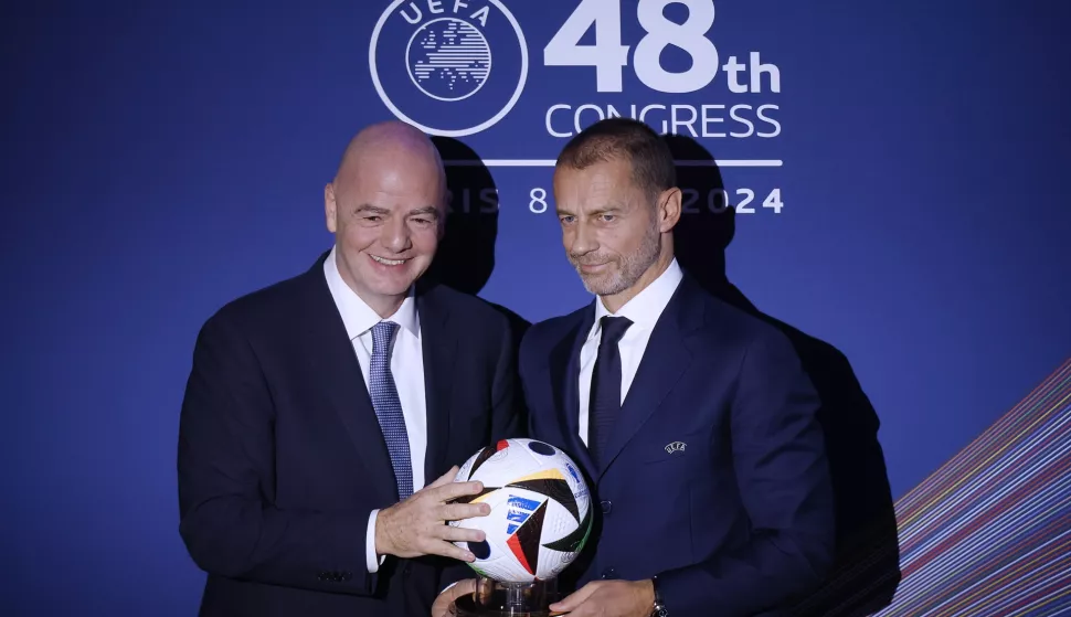 epa11135910 FIFA President Gianni Infantino (L) and UEFA president Aleksander Ceferin (R) pose during the 48th UEFA Ordinary Congress in Paris, France, 08 February 2024. EPA/YOAN VALAT