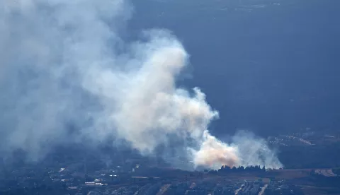 epa11611961 Smoke rises as a result of projectiles fired from southern Lebanon over Kiryat Shmona, northern Israel, 18 September 2024. The Israeli military stated that several missiles fired from Lebanon crossed into Israeli territory and were intercepted by the Iron Dome air defense system. EPA/ATEF SAFADI