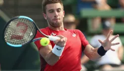 epa08126362 Borna Coric of Croatia in action against Grigor Dimitrov of Bulgaria during the Kooyong Classic at Kooyong Lawn Tennis Club in Melbourne, Australia, 14 January 2020. EPA/ROB PREZIOSO AUSTRALIA AND NEW ZEALAND OUT EDITORIAL USE ONLY