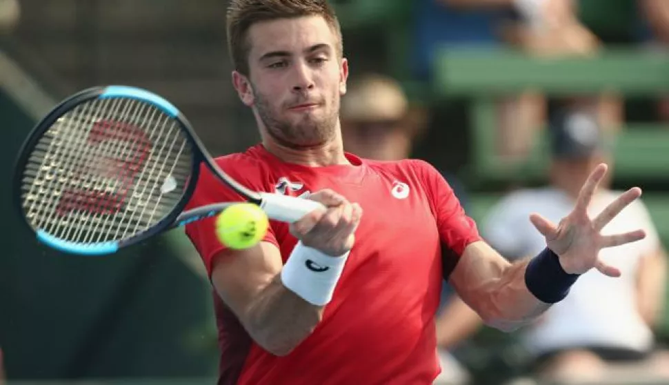 epa08126362 Borna Coric of Croatia in action against Grigor Dimitrov of Bulgaria during the Kooyong Classic at Kooyong Lawn Tennis Club in Melbourne, Australia, 14 January 2020. EPA/ROB PREZIOSO AUSTRALIA AND NEW ZEALAND OUT EDITORIAL USE ONLY